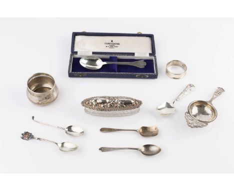 A small collection of silver, comprising a tea strainer on stand by William Suckling Ltd, Birmingham 1928, a napkin ring, Bir