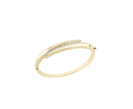 A diamond bangle, of hinged oval design, the crossover frontispiece accented with a channel of princess-cut diamonds, yellow 