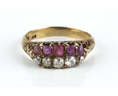 A late 19th century pink stone and diamond half hoop ring, the scroll pierced hoop with a row of graduated cushion-shaped pin