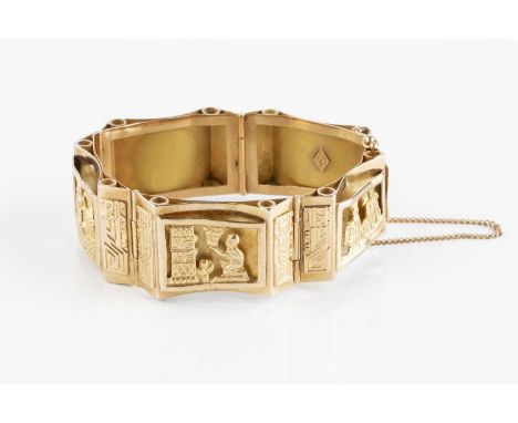 A yellow precious metal panel bracelet, the tapered panels decorated with figural scenes and stylised animal motifs, stamped 