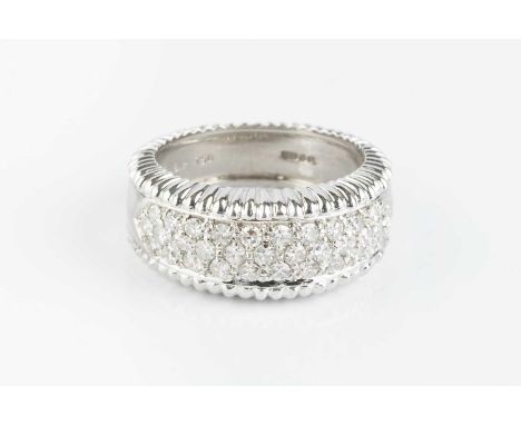 A diamond bombé dress ring, pavé set with three rows of single-cut diamonds, between fluted borders, 18ct white gold mounted,