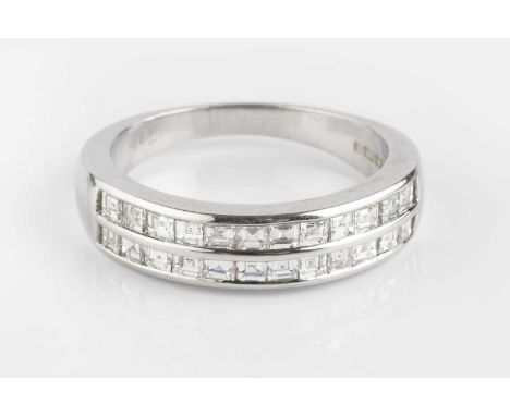 A diamond double row half hoop ring, channel set with two lines of square and rectangular step-cut diamonds, 18ct white gold 