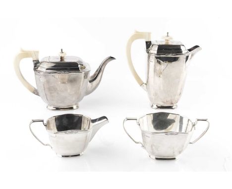 An Art Deco style silver four piece tea service, of rectangular chamfered form, comprising tea pot and hot water pot, both wi