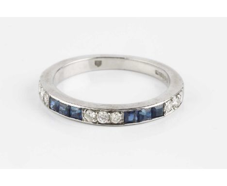 A sapphire and diamond half hoop ring, alternately set with trios of round brilliant-cut diamonds and square step-cut sapphir