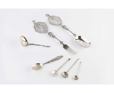 A Continental silver serving spoon and fork, the pierced handles with shaped terminals decorated with classical figures, 29cm