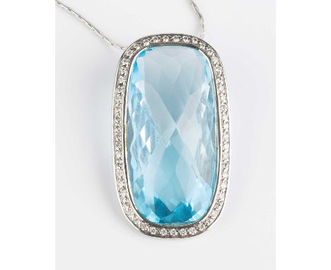 A blue topaz and diamond cluster pendant on chain, the oval fancy-cut blue topaz collet set within a border of round brillian