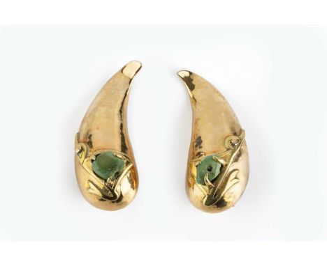 A pair of ear clips, each teardrop-shaped hollow panel applied with a stylised stone set animal motif, yellow precious metal 