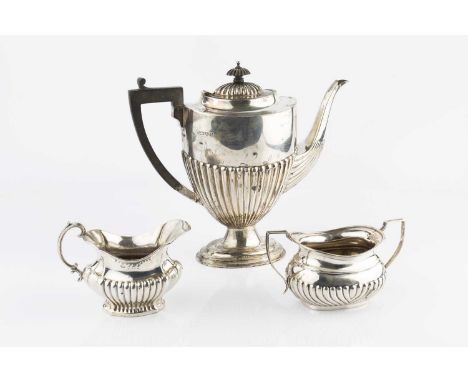 A silver coffee pot, of half lobed urn form, with ebonised handle and knop, on oval pedestal foot, by Barker Bros Ltd, Cheste