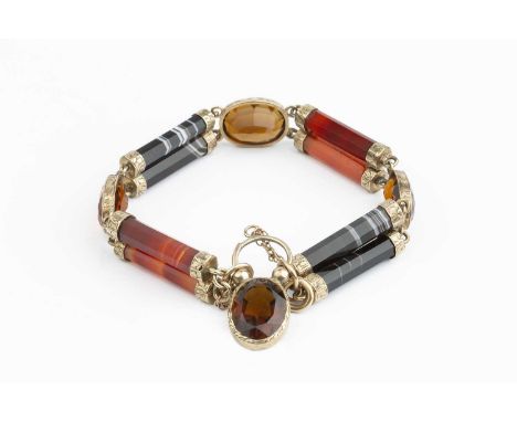 A Victorian hardstone panel bracelet, designed as a series of carnelian and banded agate batons with floral and foliate engra