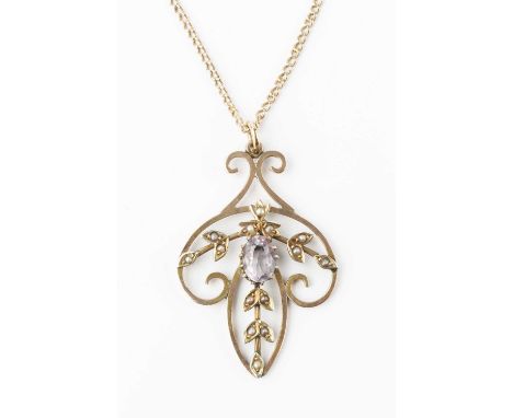 An Edwardian amethyst and half pearl pendant, the scrolled openwork panel centred with an oval mixed-cut amethyst in claw set
