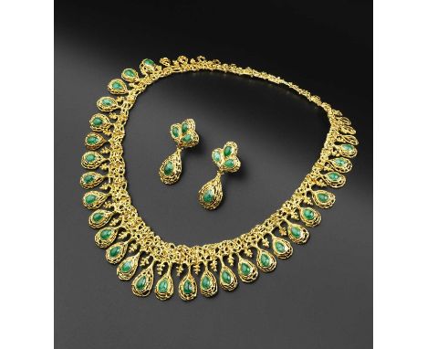 An emerald fringe necklace and ear pendants suite by David Thomas, the necklace designed as a fringe of graduated pear-shaped