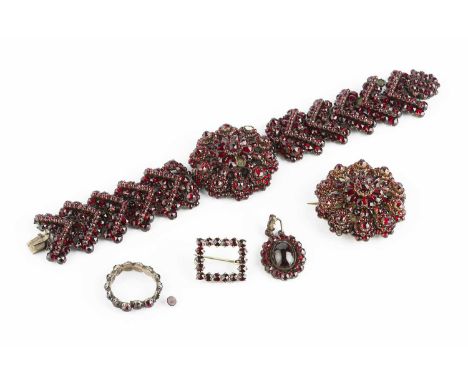 A collection of 19th century and later jewellery, comprising a cluster panel bracelet, a cluster panel brooch, a cluster pend