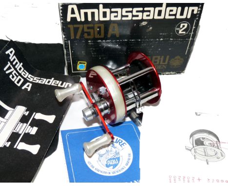REEL: Abu Ambassadeur 1750A multiplier reel in as new condition, foot stamp 761001, twin pearl handles and sandwich plate, c/