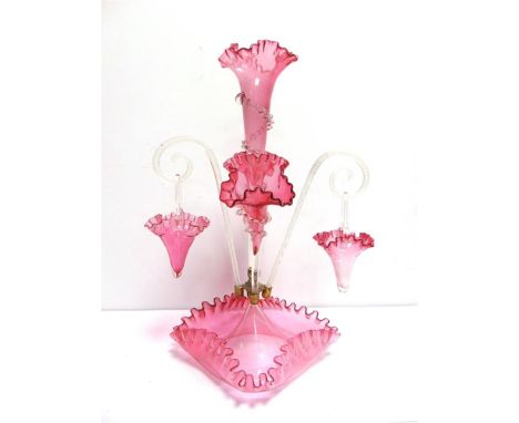 A VICTORIAN CRANBERRY &amp; CLEAR GLASS EPERGNE  with a tall central trumpet vase, two branch trumpet vases, and two branch c