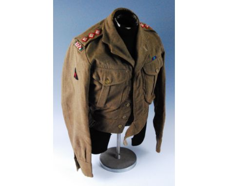 A British Army Captains great coat, bearing a label to the interior Keenan Phillips & Co naming Duncan Darroch and dated 3/12