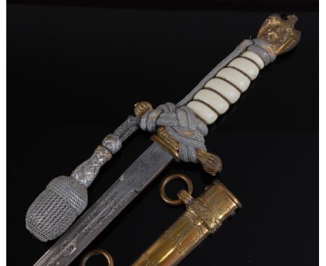 A German Third Reich Kriegsmarine Officer's dagger, the 25cm etched double fullered blade stamped to the ricasso Original Eic