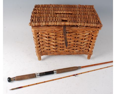 An Allcocks Light Caster 7' two piece split cane rod with gold Allcocks label, together with a wicker creel. (2)