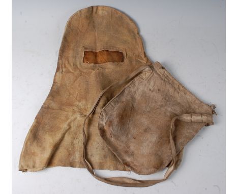 A helmet type canvas gas mask, housed in a canvas bag dated 1915.