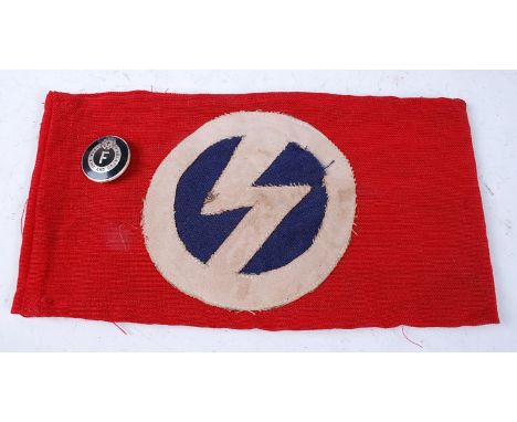 A British Union of Fascists armband, together with a Blackshirts enamel lapel badge. (2)