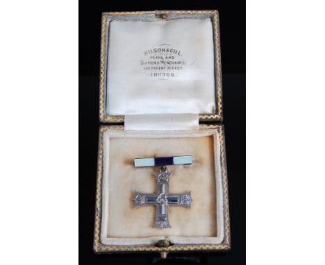 A George V Military Cross Widow's brooch in white metal on yellow metal (tests as approx. 14 carat or higher) suspended from 