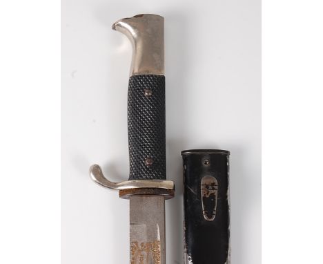 A German Third Reich Naval dress dagger, the 19.5cm fullered blade having all-over etched decoration and further etched "Fur 