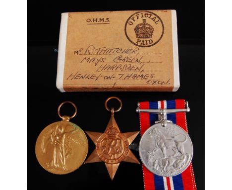 A WW I Victory medal, naming K. 39225 R.C. THATCHER. STO. 1. R.N., together with WW II 1939-45 Star and War medals in O.H.M.S