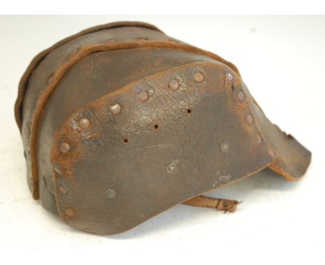 A British 1916 pattern brown leather Tank Corps helmet, of rivetted four piece construction with leather liner stamped Hobson