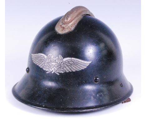 A WW II German Luftschutz Civil Defence helmet, converted from a captured Czech helmet with leather liner and chin strap stam