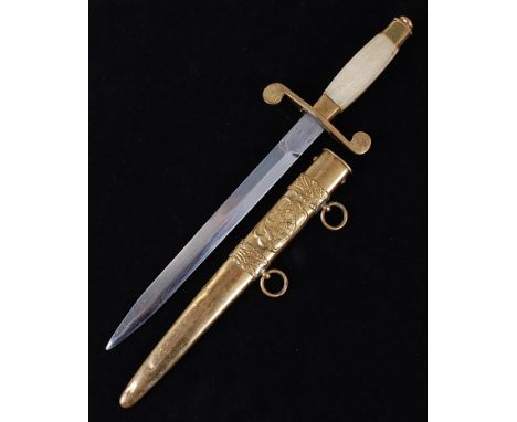 A Socialist Romanian Army dress dagger, the 21cm blade stamped to the ricasso 12682, having a brass cross guard with simulate