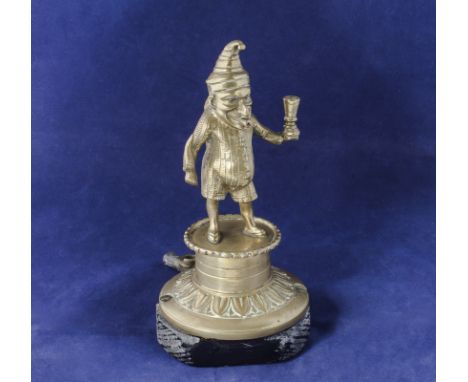 A brass cigar lighter modelled as Punch