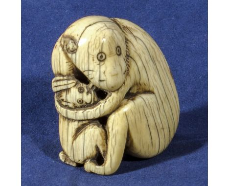 An ivory netsuke modelled as a monkey and baby