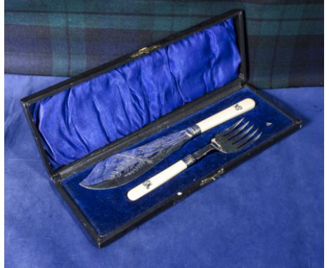 A silver collared fish knife and fork in case