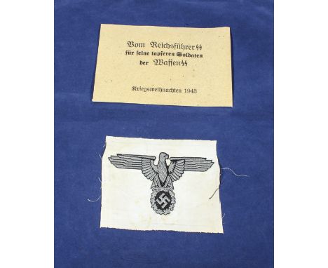World War II German SS envelope for smoking pipe together with a WWII vest eagle