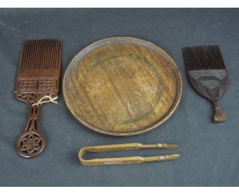 TWO TRADITIONAL WELSH PIERCED AND CHIP CARVED HAIR COMBS, a pair of lovespoon type pierced and geometrically decorated sugar 