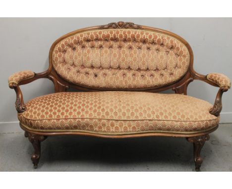 VICTORIAN WALNUT SHOW FRAME SOFA, having oval buttoned back with moulded foliate cresting, open scrolled foliate padded arms 