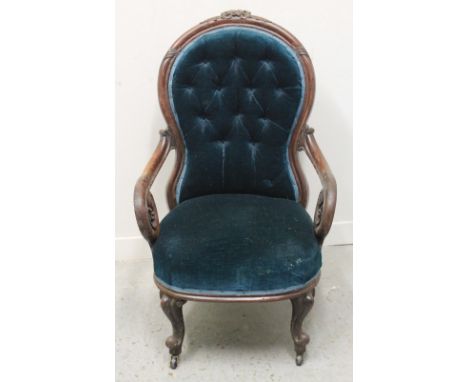 VICTORIAN ROSEWOOD SHOW FRAME OPEN ARMED LADIES FIRESIDE CHAIR having foliate moulded cresting, scrolled open arms, buttoned 