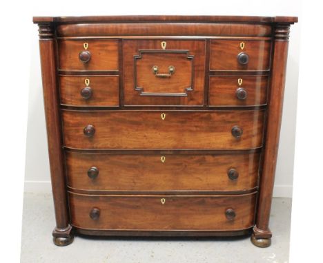 EARLY 19TH CENTURY MAHOGANY BOW FRONTED 'SCOTCH' COLUMN CHEST OF DRAWERS, having centre box draw flanked by two pairs of shor