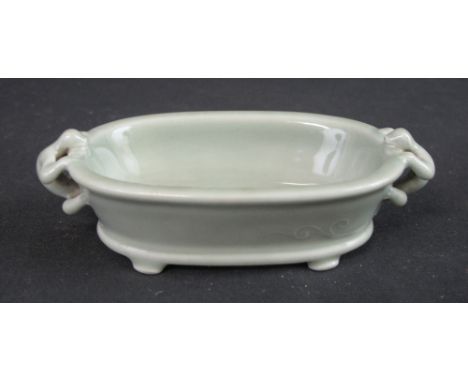 CHINESE PORCELAIN OVAL CELADON GLAZED BRUSH WASHER with pierced Chilong handles and stub feet. Underglazed blue six character