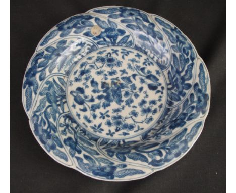 CHINESE PORCELAIN KANGXI STYLE UNDERGLAZE BLUE DECORATED BROAD RIMMED DISH, overall with writhen foliate bands and a central 