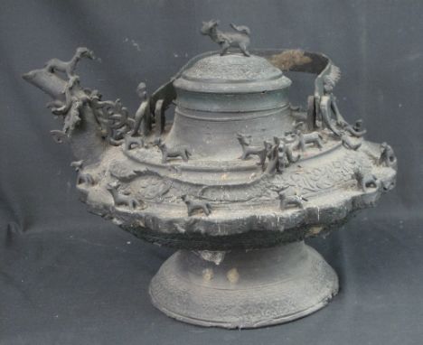 A MASSIVE ZOOMORPHIC CEREMONIAL BALUSTER SHAPED BRONZE METAL CEREMONIAL KETTLE, believed to be of Iban Malais origins from No