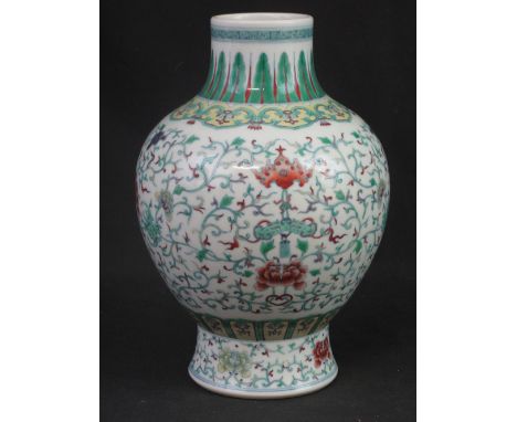 CHINESE PORCELAIN BALUSTER SHAPED 'DOUCAI' STYLE POLYCHROME DECORATED VASE with overall scrolled floral decoration including 