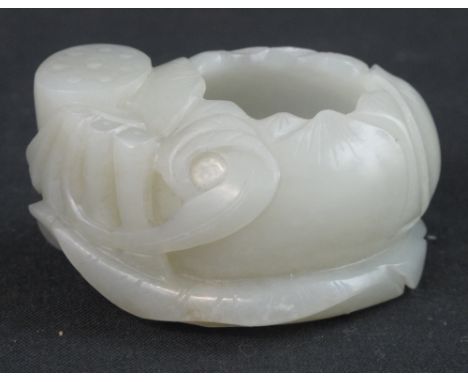 CHINESE CARVED JADE MINIATURE BRUSH WASHER in the form of a lotus flower with seed pod. 6cm across. CONDITION REPORT: No obvi