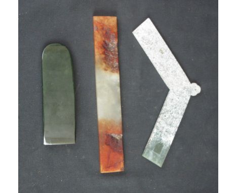 THREE ITEMS OF ORIENTAL CARVED HARDSTONE to include spinach green chisel or axe head shape, an angular jade gong and a brown 