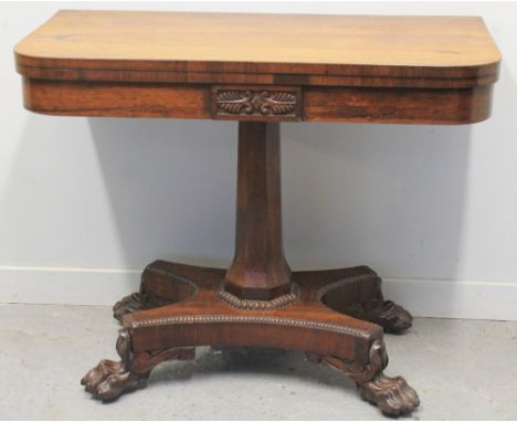 GEORGE IV ROSEWOOD FOLD OVER CARD TABLE, having curved angles an baize playing surface above foliate moulded frieze panel, on