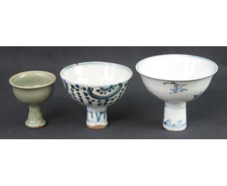 THREE CHINESE MING STYLE STEM CUPS, the larger in underglaze blue decorated with horses and other animals.  14cm across.  Sec