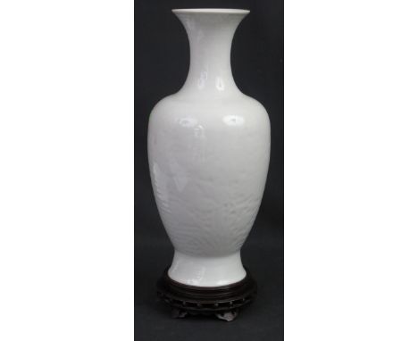 CHINESE PALE CELADON PORCELAIN, BALUSTER SHAPED VASE with moulded leaf decoration on honeycomb ground.  Impressed Quin Long s