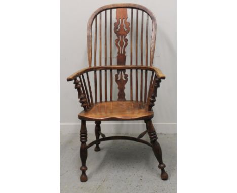 19TH CENTURY ASH AND ELM SPLAT BACKED WINDSOR BOW CHAIR with pierced splat, baluster turned supports, saddle moulded seat, on