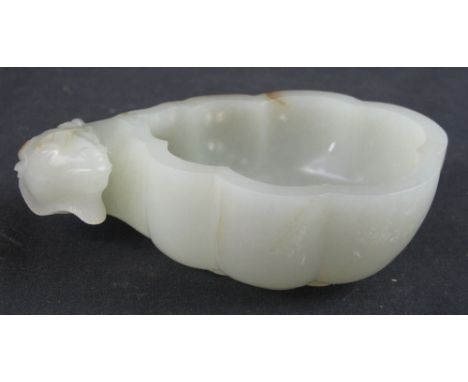 A CHINESE WHITE JADE HARDSTONE BRUSH WASHER with round head mount. 12cm across. CONDITION REPORT: Some brown stains/blemishes