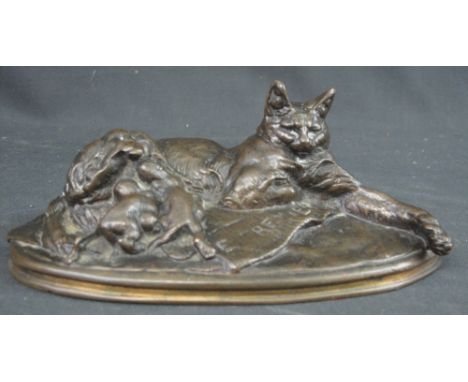 EMMANUEL FREMIET (French, 1824-1910) study of a recumbant cat with her kittens on oval naturalistic base. Patinated bronze, 2
