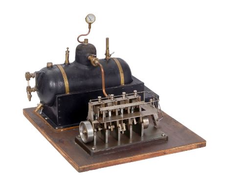 Vierzylinder-Dampfmaschine mit Kessel, um 1930Kessel aus Gußmetall, Länge 26 cm, Ø 10 cm, mit Wasserstandglas, Manometer, Dam